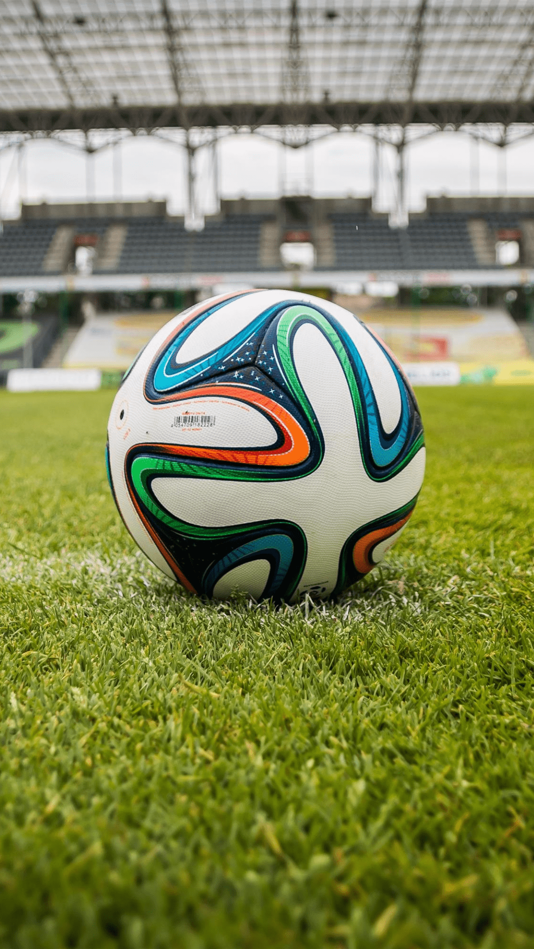Football in centre of stadium